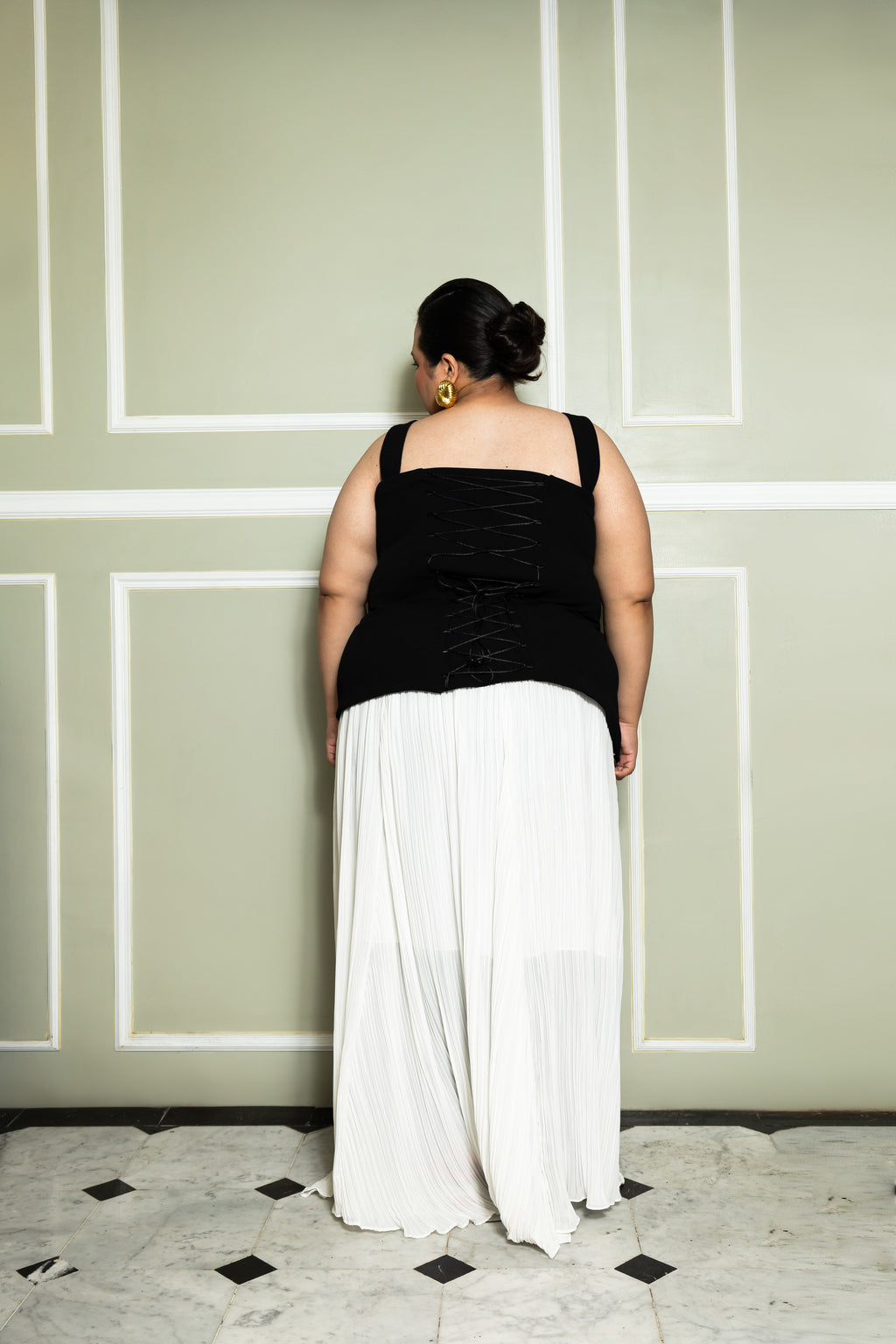 Top de crepé con forro y elementos de corsé